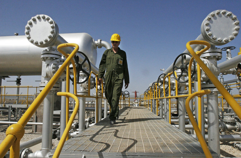 Iranian oil technician Majid Afshari makes his way to the oil separator facilities in the Azadegan oil field southwest of Tehran in 2008. Iran says it has stored imported goods and hard currency for a “battle” against EU sanctions.