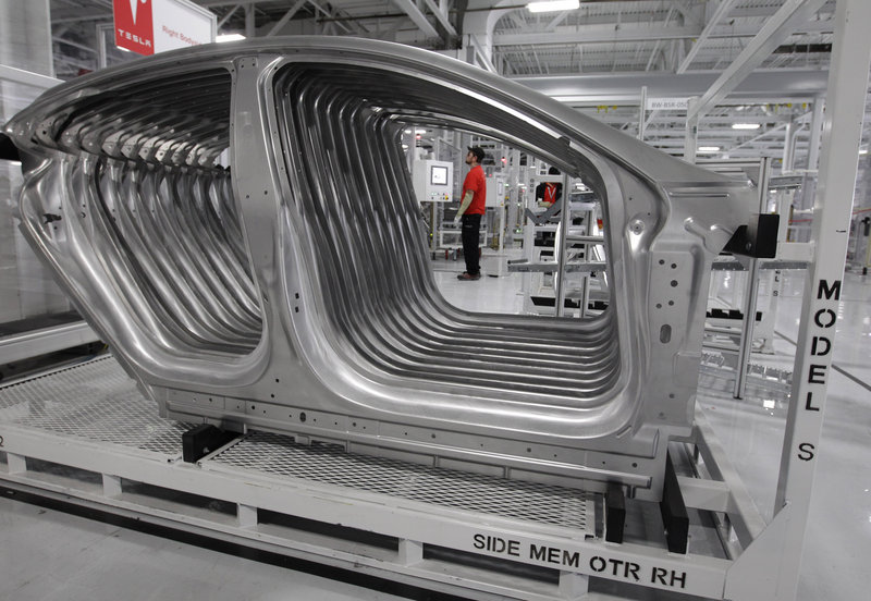 Tesla Model S frames sit in the assembly area at the Tesla factory in Fremont, Calif. U.S. manufacturing declined in June for the first time in nearly three years, a report said Monday.
