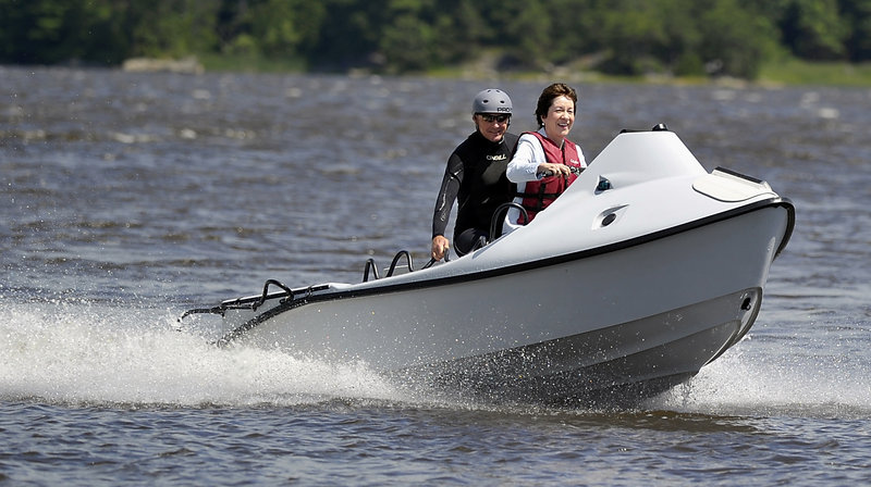 U.S. Sen. Susan Collins test drives a Greenough Advanced Rescue Craft built for the military by Hodgdon Defense Composites in Bath, joined by the designer, Peter Maguire of Rapid Rescue Technology. “In breaking surf, it can do things that no other vessel can do,” he said.