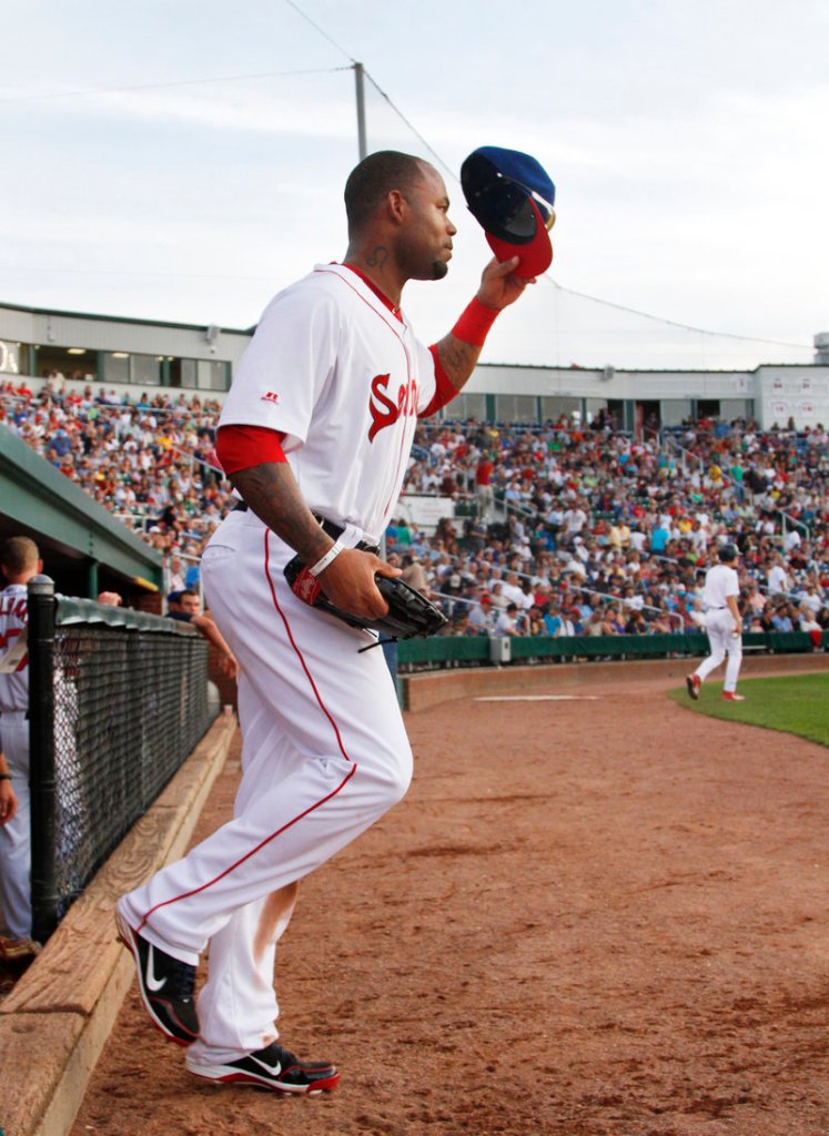 Carl Crawford tips his cap Tuesday night while taking the field for his first rehab appearance for the Portland Sea Dogs at a sold-out Hadlock Field. Crawford went 1 for 2 with two walks.