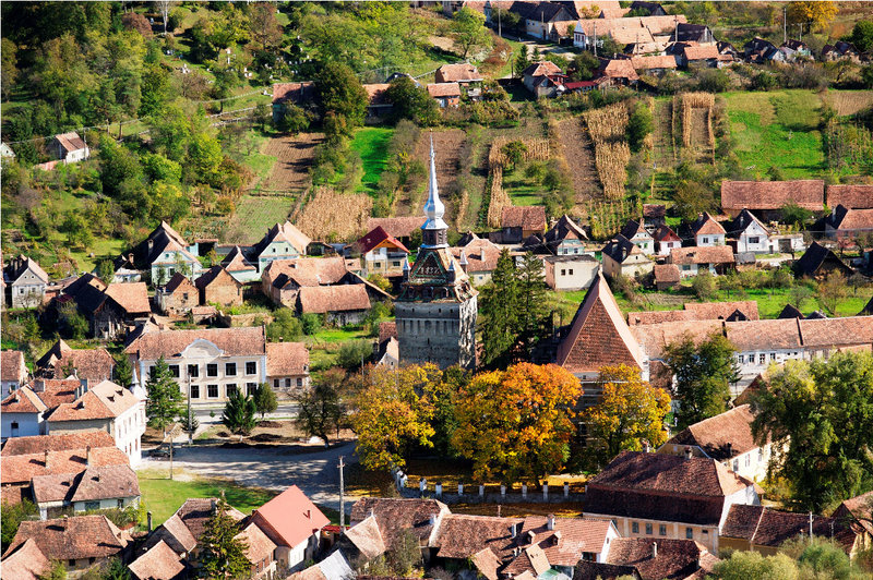 Rooftops, farms and the church form a pretty picture in Saschiz, a town in the Transylvania region of Romania.