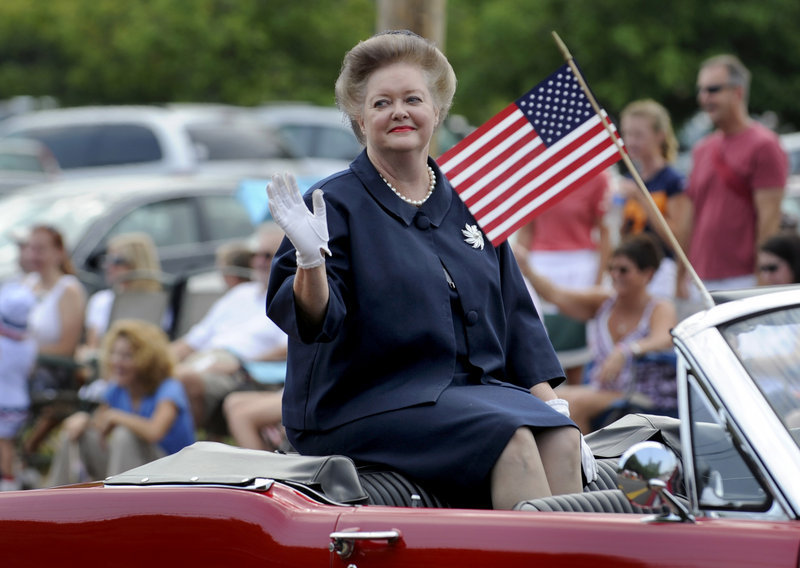 Georgia Branam with The Andy Griffith Show Rerun Watchers Club, Mayberry Chapter, waves to the crowd as she rides in the 25th annual Independence Day parade Wednesday in Farragut, Tenn.