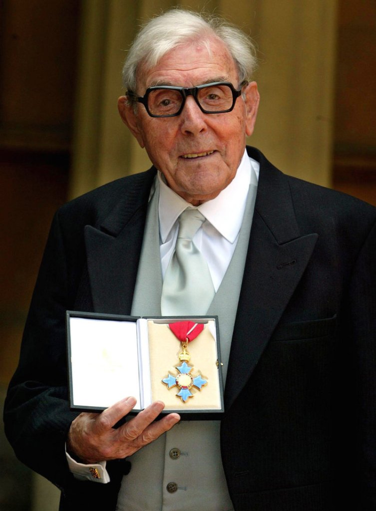 Eric Sykes, the veteran English comic actor and writer, holds the CBE, or Commander of the British Empire, award he received from Britain’s Queen Elizabeth II at a Buckingham Palace investiture, in London in 2005. Sykes, who was one of the most popular comic actors of his generation, and appeared in shows in London’s West End into his 80s, died Wednesday morning after a short illness. He was 89.