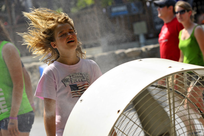 Daisy Zuscar, 12, of Clamore, Okla., cools off at Knoebels Amusement Resort in Elysburg, Pa., Friday.