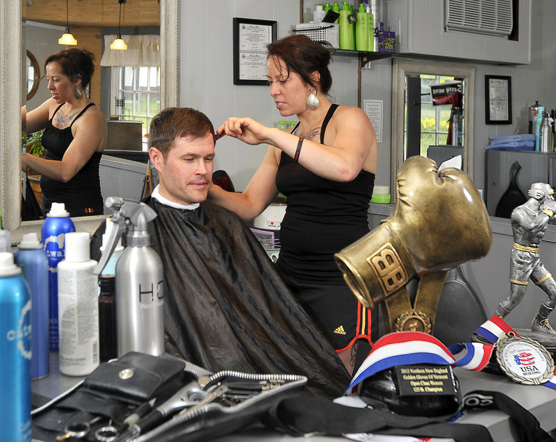 Liz Leddy is never far from boxing, even as she cuts the hair of Jeremy Young of Freeport at her salon in Portland. Leddy is a two-time national Golden Gloves champion.