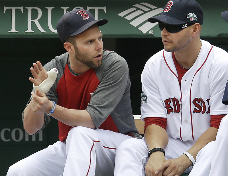 Dustin Pedroia, left, can only sit and watch with his thumb injury as Cody Ross and the rest of the team lead the charge on a Red Sox season that continues to go nowhere.