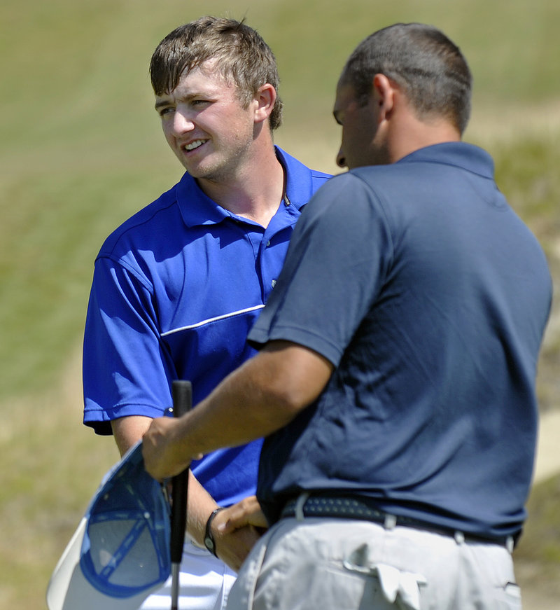 Seth Sweet of Madison, left, receives congratulations Thursday for winning the Maine Amateur from J.J. Harris, who tied for second. Sweet is heading to Old Dominion in the fall.