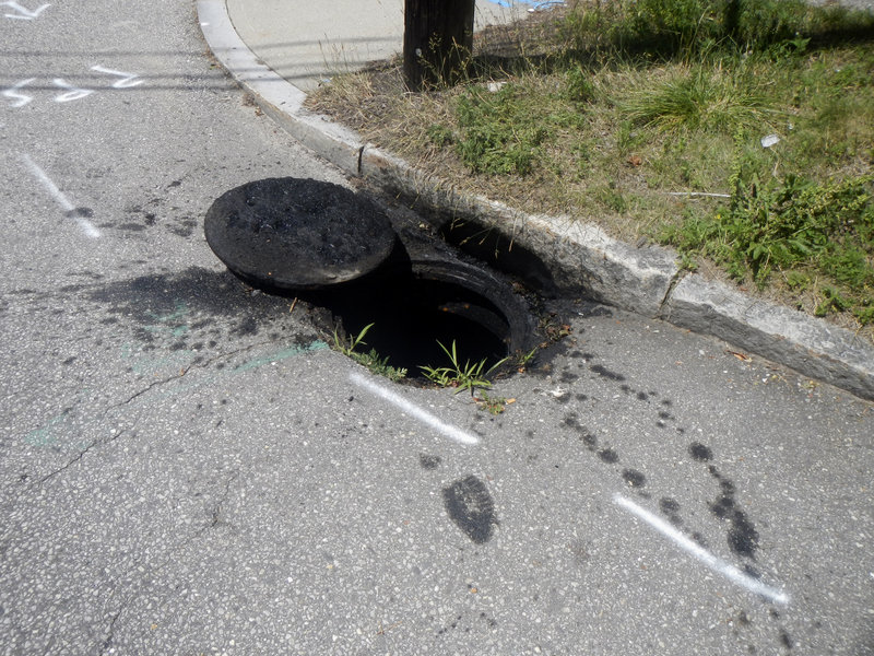 This is one of two stormwater catch basins at Falmouth and St. John streets where public works employees discovered illegally dumped old home heating oil.