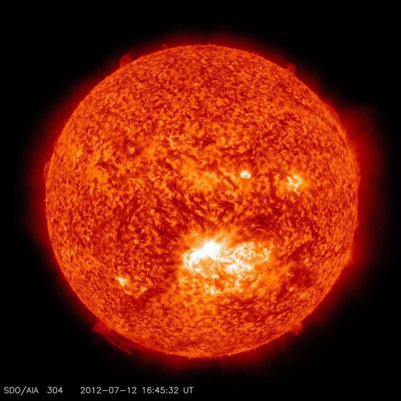 Image captured by NASA shows a solar flare, lower center, erupting from the sun on Thursday.