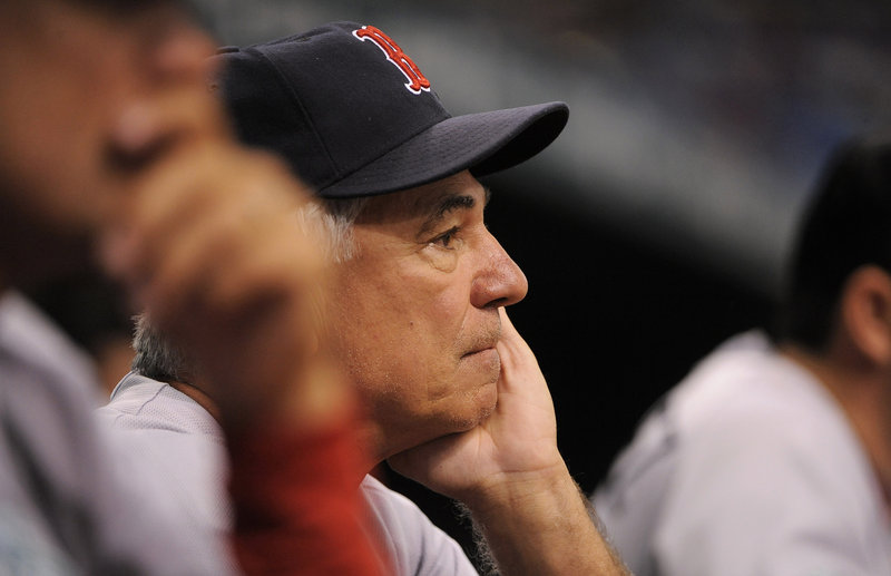 Red Sox Manager Bobby Valentine ponders his next move in Sunday’s game at St. Petersburg. Fla. The Sox won, 7-3.