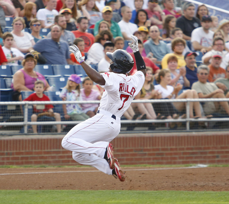 Jackie Bradley Jr. slides into third for a leadoff triple in the first inning Monday night for the Portland Sea Dogs, who were beaten 11-4 by Reading.