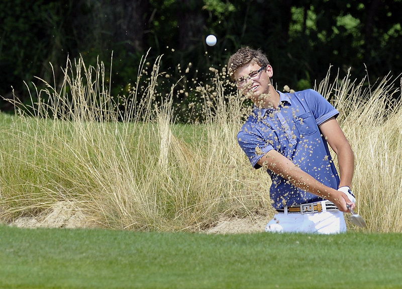 Dylan Mattos, who plays out of LeBaron Hills Country Club in Lakeville, Mass., blasts out of a greenside bunker on the 11th hole Tuesday during the first round of the New England Amateur at Falmouth Country Club. Mattos finished with a 75.