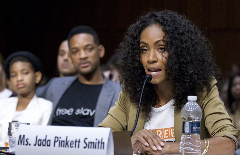 Jada Pinkett Smith, accompanied by her actor husband, Will Smith, and their daughter Willow Camille Reign Smith, left, testifies before the Senate Foreign Relations Committee on Tuesday.