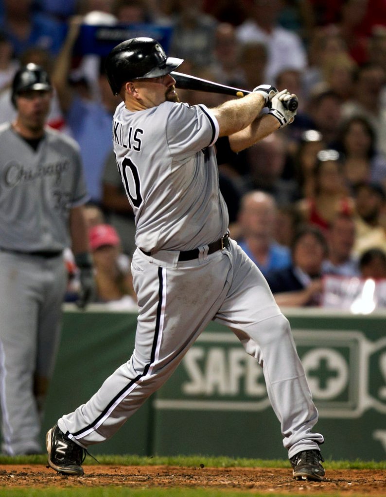 Kevin Youkilis follows through on his three-run homer in the fourth inning Tuesday night, helping the Chicago White Sox build a lead that led to a 7-5 victory against the Boston Red Sox at Fenway Park.