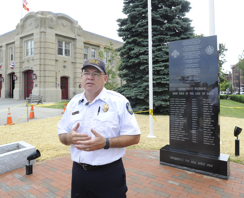 Portland Deputy Fire Chief David Jackson stands in front of the Portland Fire Department Fallen Fire Fighter Memorial at Central Fire Station on Congress Street. The memorial will be dedicated July 28.