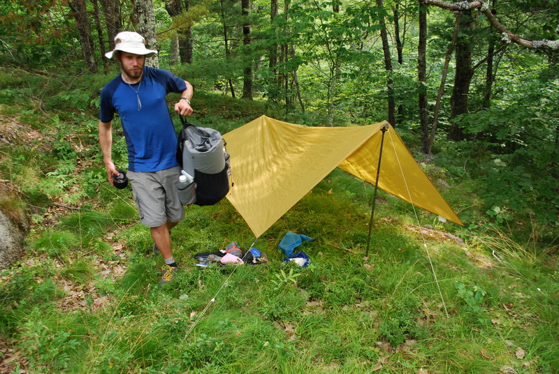 Ryan Linn sets up his tent with his ultra-light gear, which consisted of a light tarp, hiking poles and string. Linn said it’s best to carry gear with multiple uses to save weight on backpacking trips.