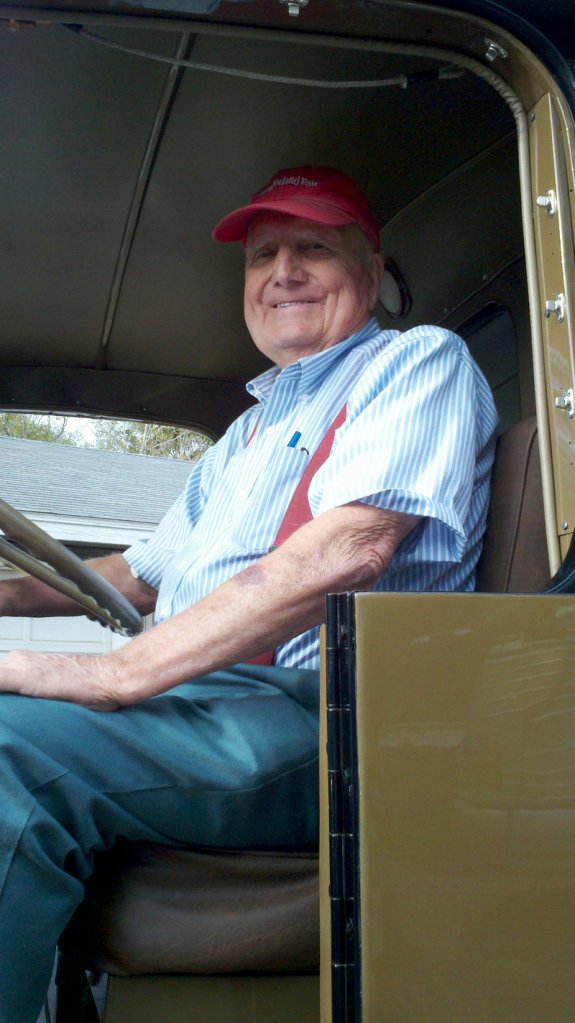 Erv Bickford is shown in 2011 in one of the trucks he restored.