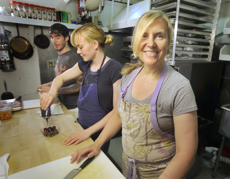 In 2010, women in food preparation and serving jobs earned 82 percent of what a man made. Krista Kern Desjarlais, front, owner of Portland’s Bresca, says her line cooks, Blaine Pitcock, left, and Shelby Stevens, do the same work and earn the same pay.