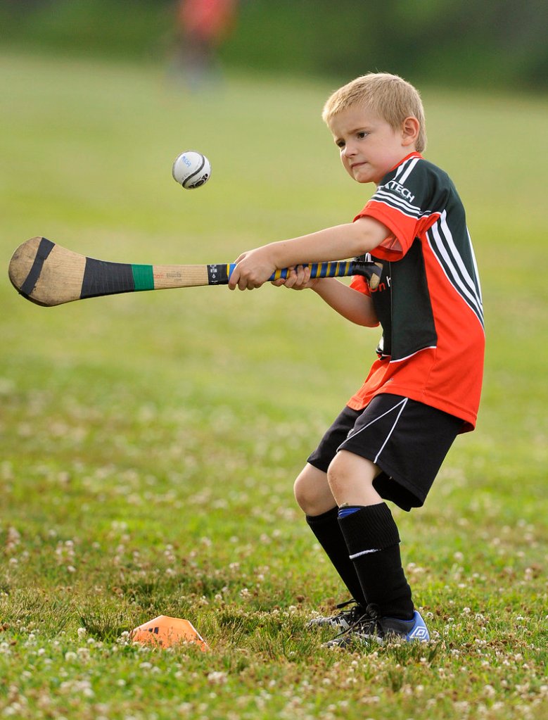 Conall Matthews, 7, is one of the young players who have discovered hurling and Gaelic football during Wednesday night practices this summer in South Portland.