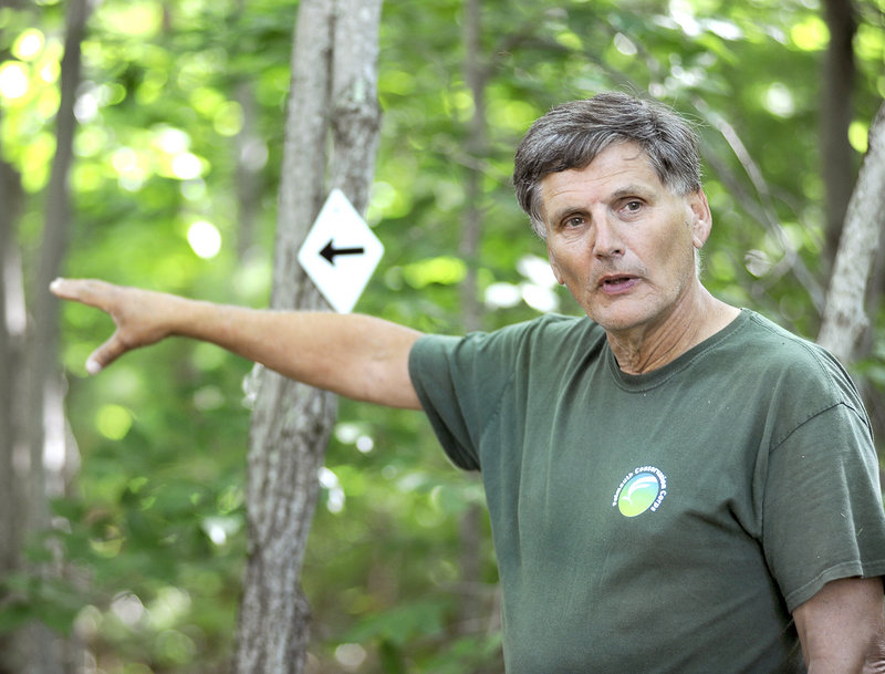 Bob Shafto, open-space ombudsman for Falmouth, gives a tour of Suckfish Brook Conservation Area on Friday. He said the land should stay the way it is for many reasons.