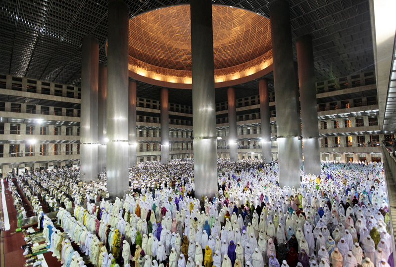 Indonesian Muslims perform an evening prayer called “tarawih,” marking the first eve of the holy fasting month of Ramadan at Istiqlal Mosque in Jakarta, Indonesia, on Friday.
