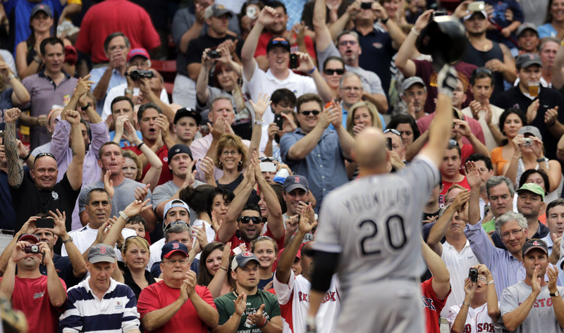 Kevin Youkilis of the White Sox greets the crowd at Fenway Park on July 16. A reader who attended that game says that by tightening the limit on soot emissions, federal regulators could save 37,700 American lives a year, “equivalent to a packed house at Fenway Park.”