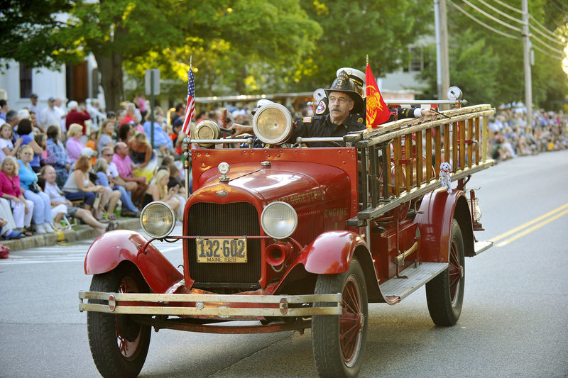 A truck from New Gloucester Fire Deparment joins others old and new as they roll down Main Street in Yarmouth on Friday during the annual Clam Festival Parade.