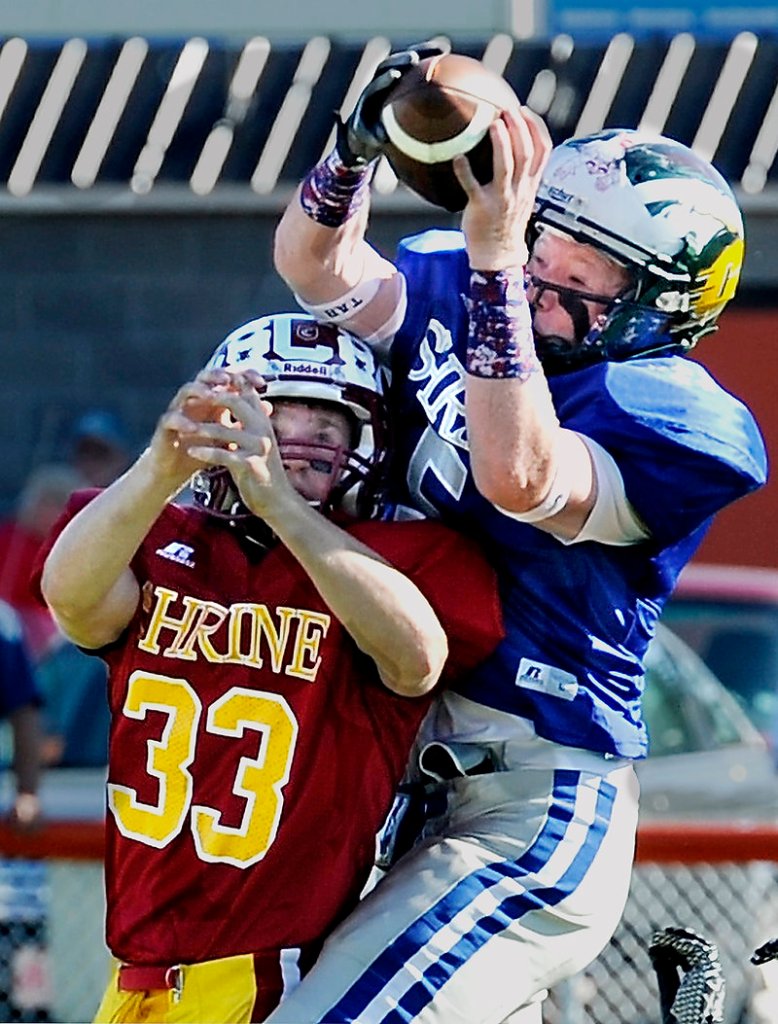 Matt Burnell of Bonny Eagle, right, hauls in a pass for the West while guarded by Wyatt Frost of Bangor during the first half Saturday in the Lobster Bowl. The West rallied for a 48-24 victory.