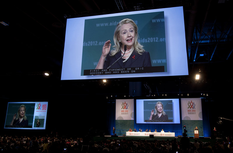 Secretary of State Hillary Clinton is seen on multiple video screens as she speaks at the International AIDS Conference on Monday in Washington, D.C. “I am here today to make it absolutely clear the U.S. is committed and will remain committed to achieving an AIDS-free generation,” Clinton told the more than 20,000 scientists, people living with HIV and policymakers at the conference.