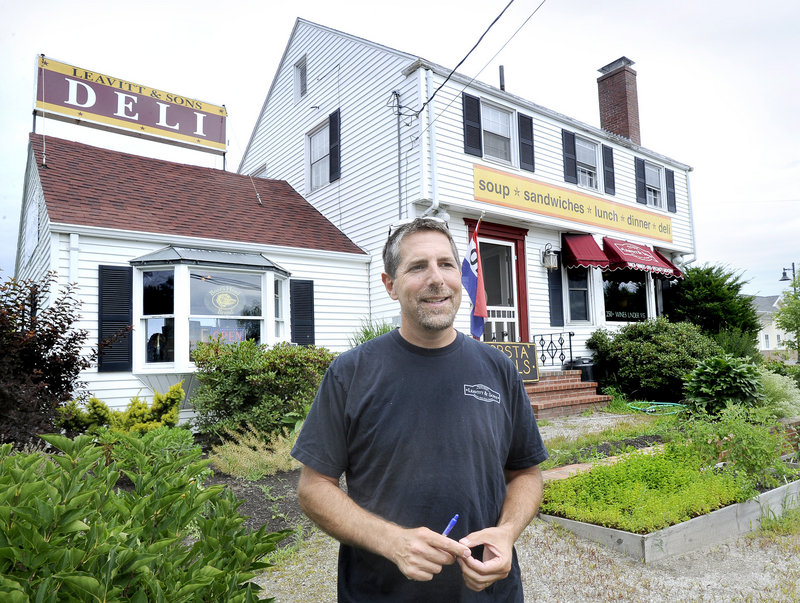 Peter Leavitt, in front of the Leavitt & Sons Falmouth location in 2014, plans to open a second deli location in Portland.
