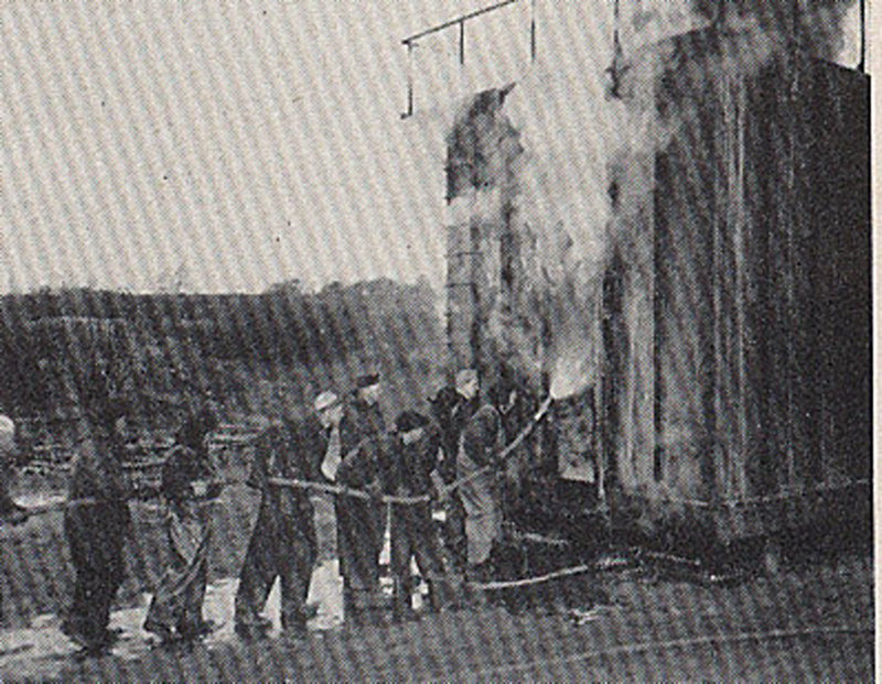 A 1945 photo shows sailors attacking an oil fire in a firefighter training structure built by the U.S. Navy on Little Chebeague Island.