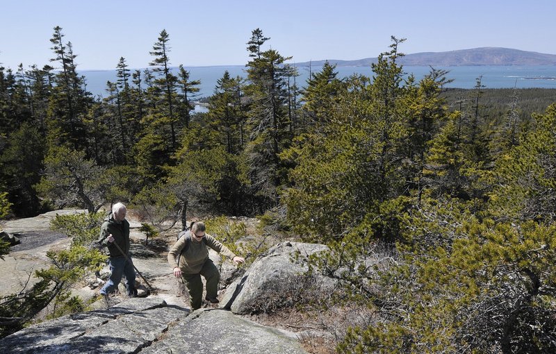Hikers negotiate a rocky path in Acadia National Park. Despite a fatal fall at the park last week, Acadia is pretty safe compared to other parks, figures show.
