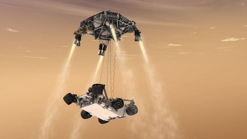 A rendering shows a “sky crane” lowering the rover onto the surface of Mars.