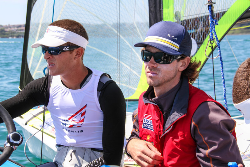 Dave Hughes, right, isn’t allowed to talk with his crew members during an Olympic event, but prepares them before each race and goes over everything that happened afterward.