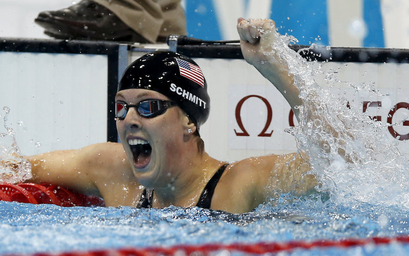 Allison Schmitt of the United States reacts to her gold- medal win in the women’s 200-meter freestyle. Schmitt set an Olympic record of 1:53.61.