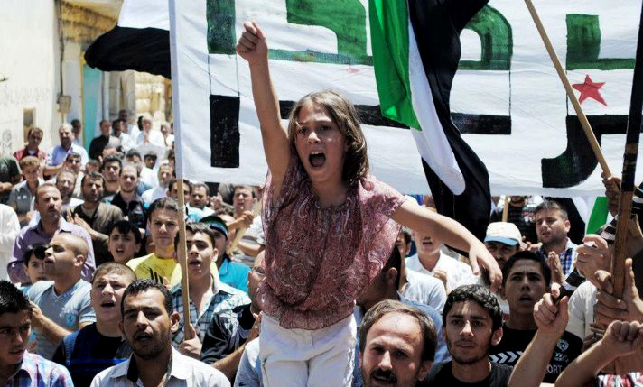 A Syrian girl chants slogans during a demonstration in Idlib, Syria, in this citizen journalism image provided by the Local Coordination Committees in Syria and accessed Friday.