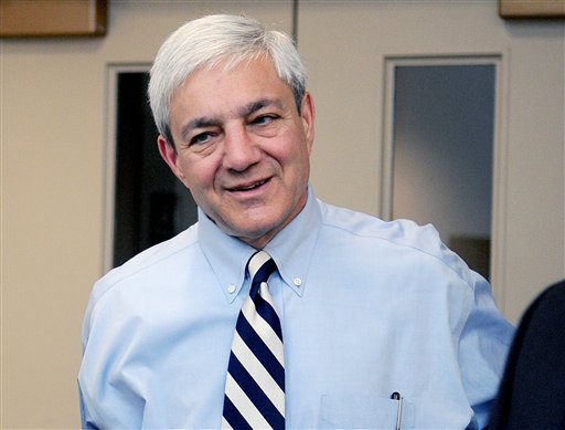 In this July 12, 2012, photo, Penn State President Graham Spanier arrives at the University Park Airport in State College, Pa. Spanier and his lawyers attacked the university-backed report on the Jerry Sandusky sex abuse scandal on Wednesday, Aug. 22, 2012, in Philadelphia, calling it a "blundering and indefensible indictment" as they fired a pre-emptive strike while waiting to hear if he'll be charged in the case. (AP Photo/Centre Daily Times, Abby Drey) MANDATORY CREDIT; MAGS OUT