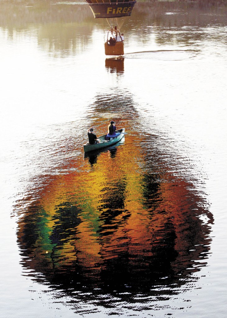 A pilot dips the basket of his hot air balloon in the Androscoggin River in August 2011. The Riverwalk will soon offer visitors to Brunswick and Topsham close-up views of the river, as well as a scenic walk through the woods.