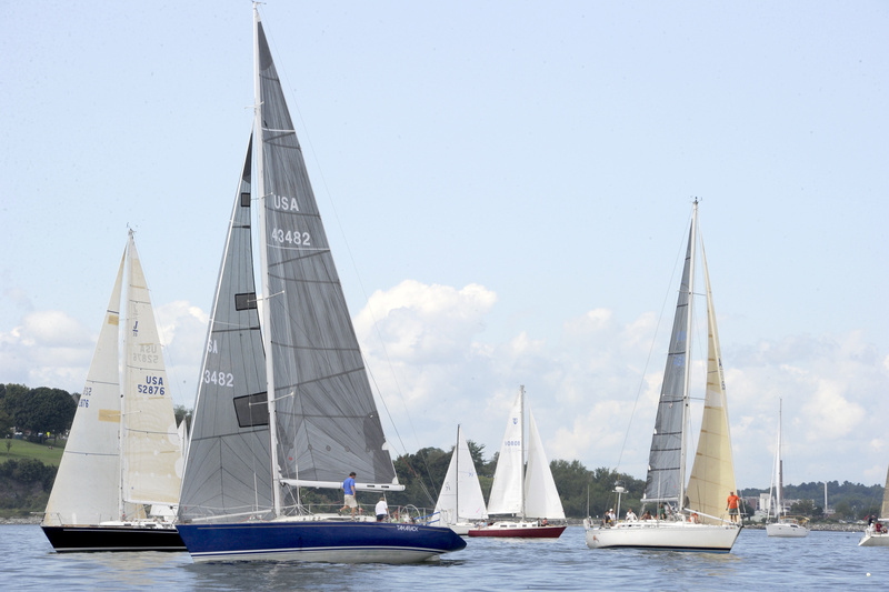 Sugar Sugar (black hull) and Family Wagon (blue hull) fight for position at the racing division 1 start during the 31st annaul MS Regatta in Portland Harbor on Saturday.