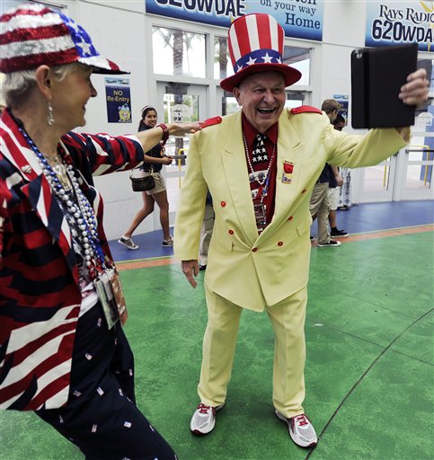 Col. Oscar Poole, right, and Claire Simpson, both of Georgia, arrive at the 2012 Tampa Bay Host Committee�s welcoming event for the delegates of the Republican National Convention on Sunday, Aug. 26, 2012 at Tropicana Field in St. Petersburg, Fla. (AP Photo/The Tampa Tribune, Chris Urso, Pool)