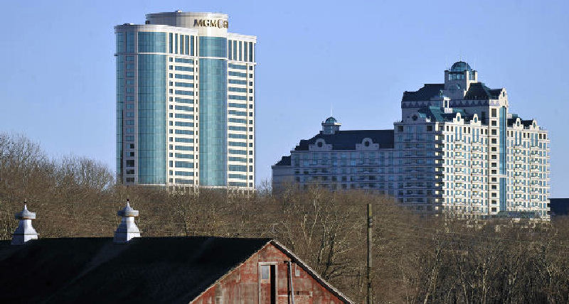 Foxwoods Resorts Casino and MGM Grand at Foxwoods buildings loom behind a barn in Mashantucket, Conn.
