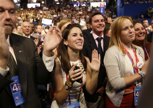 Delegates react as Republican presidential nominee Mitt Romney addresses delegates before speaking at the Republican National Convention in Tampa, Fla., on Thursday, Aug. 30, 2012. (AP Photo/David Goldman)