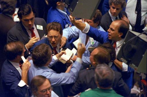 Traders on the floor of the New York Stock Exchange work frantically as panic selling swept Wall Street on Monday, Oct. 19, 1987. The Dow Jones industrial average plunged 508 points for the biggest one-day percentage decline in the history of the index.