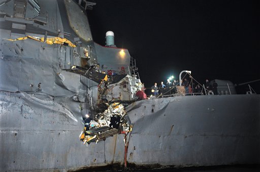 In this image released by the U.S. Navy, the guided-missile destroyer USS Porter is seen after it collided with an oil tanker.