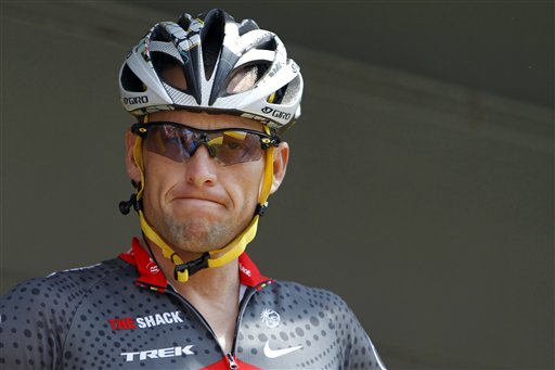 In this July 6, 2010, file photo, Lance Armstrong grimaces prior to the start of the third stage of the Tour de France cycling race in Wanze, Belgium. Armstrong said on Thursday, Aug. 23, 2012, that he is finished fighting charges from the United States Anti-Doping Agency that he used performance-enhancing drugs during his unprecedented cycling care