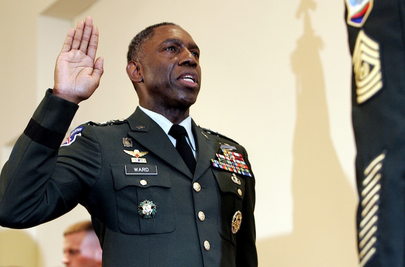 In this May 26, 2006 file photo, Army Lt. Gen. William E. Kip Ward is adminstered the oath of four-star General, the Army's highest rank of general, by Command Sgt. Major Mark Ripka, right, at Fort Myer, Va. The Associated Press has learned that Ward, who was the first head of the new U.S. Africa Command is under investigation and facing demotion for possibly spending hundreds of thousands of dollars improperly on lavish travel, hotels and other items. Several defense officials said Wednesday that Defense Secretary Leon Panetta is expected soon to decide the fate of Ward. (AP Photo/Caleb Jones, File)