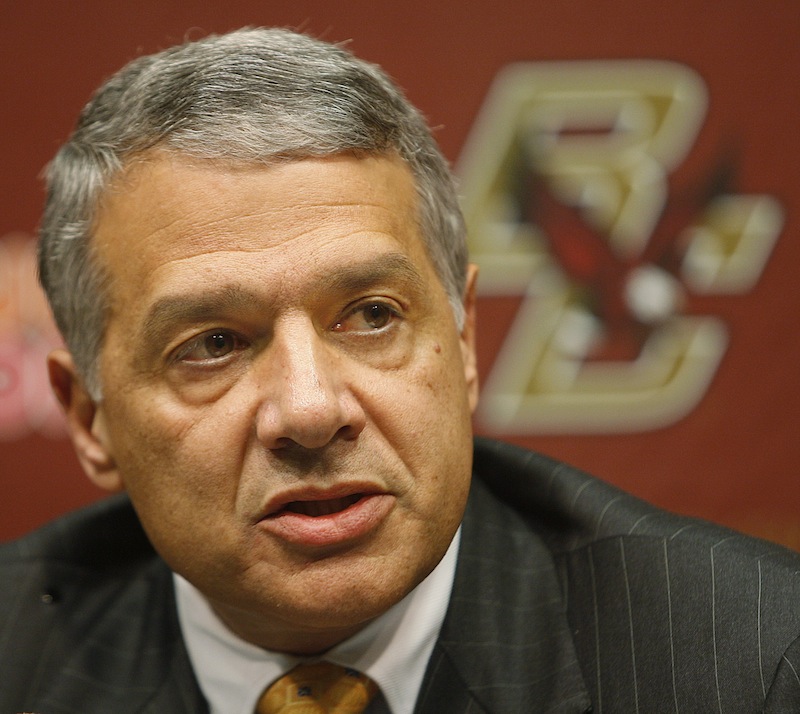 In this Jan. 7, 2009, file photo, Boston College athletic director Gene DeFilippo announces the firing of head football coach Jeff Jagodzinski during a news conference in Boston. DeFilippo took over the BC athletic department in 1997 in the wake of a gambling scandal and presided over its move from the Big East to the Atlantic Coast Conference announced on Friday, Aug. 17, 2012, that he is leaving, effective Sept. 30. (AP Photo/Stephan Savoia, File)