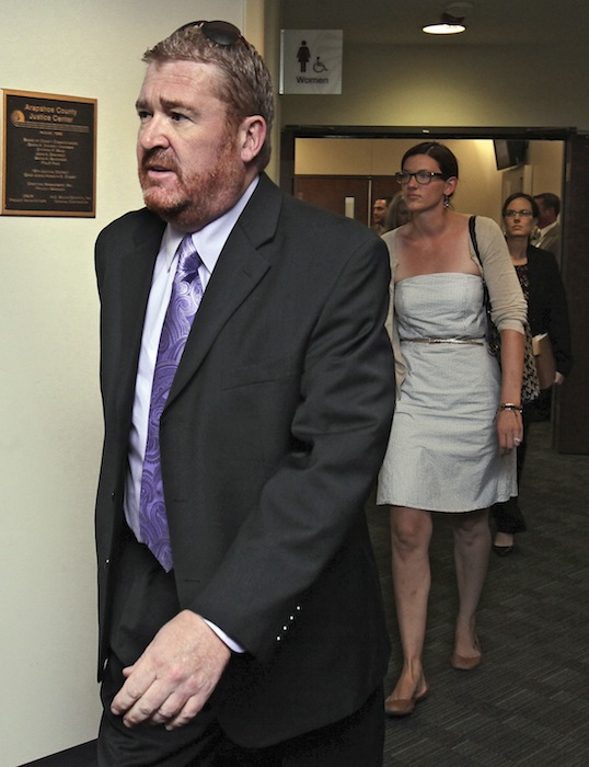 Defense attorney Daniel King leads other public defenders into court for a motions hearing for suspected theater shooter James Holmes in district court in Centennial, Colo., on Thursday, Aug. 30, 2012. Holmes has been charged in the shooting at the Aurora theater on July 20 that killed twelve people and injured more than 50. (AP Photo/Barry Gutierrez)