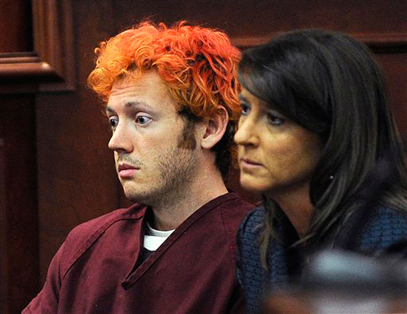 In this Monday, July 23, 2012 file photo, James Holmes, accused of killing 12 people in Friday's shooting rampage in an Aurora, Colo., movie theater, appears in Arapahoe County District Court with defense attorney Tamara Brady in Centennial, Colo. The prosecution is claiming Holmes made previous threats before the theater rampage. (AP Photo/Denver Post, RJ Sangosti, Pool, File)