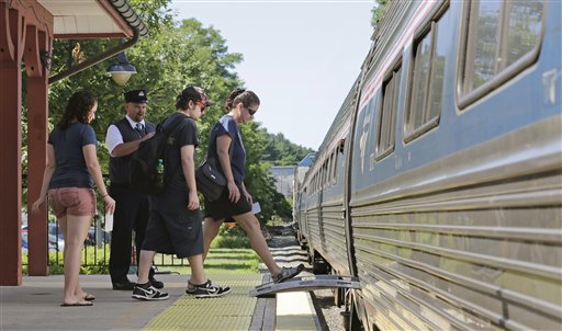 In this file photo, passengers board Amtrak's Downeaster train at the station in Exeter, N.H. As the Downeaster nears scheduled service in Freeport, some residents and businesses are concerned about the train's whistle.